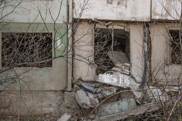 Dilapidated residential building with empty windows