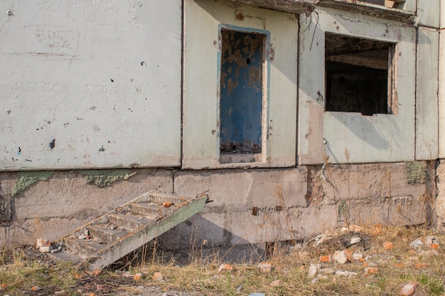 Dilapidated residential building with empty windows