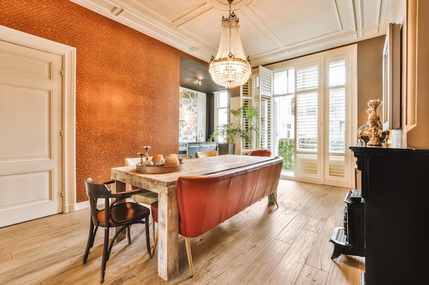 A dining room with a table and a leather chair