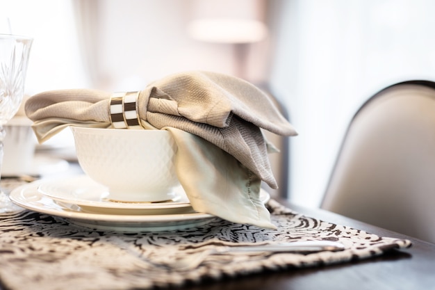 dining set with dish and spoon on white clean napkin