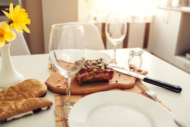 Dinner setting for two served in kitchen modern kitchen design roasted meat with wine in dining room