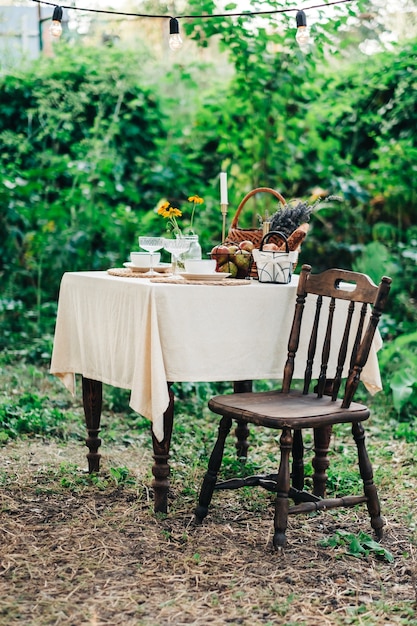 Dinner table in the backyard outdoors in countryside, nobody.