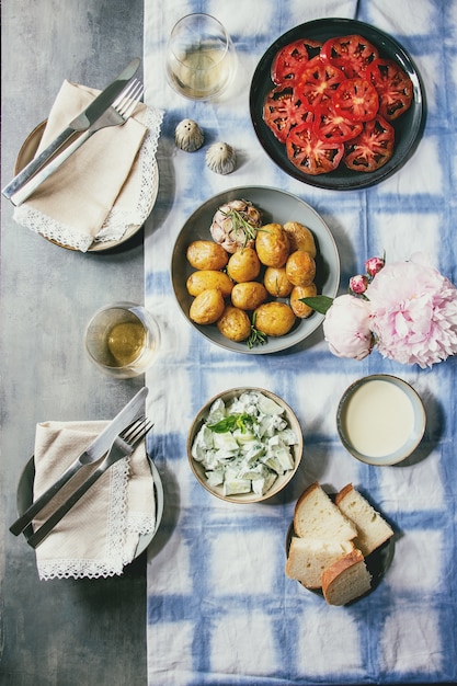 Dinner table with baked potatoes