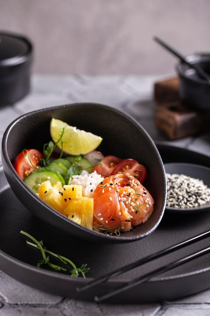 Dinner with fresh poke salad with salmon