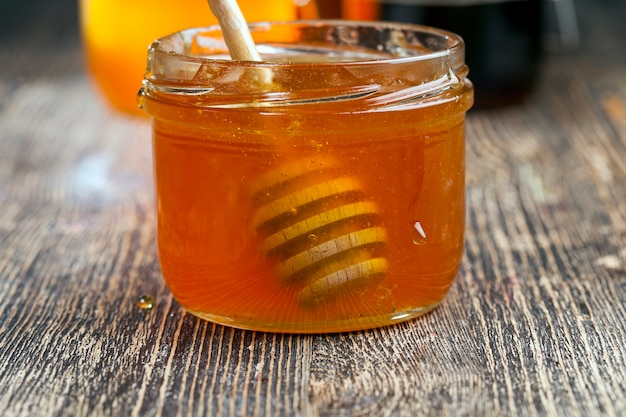 Dipped in honey specially made from wood homemade coarse spoon, sweet bee honey and wooden spoon that allows you to transfer and pour honey without dripping and spreading