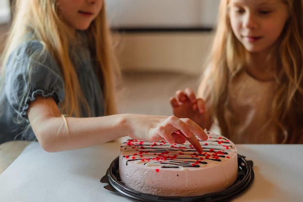 direct children girls caps without hesitation eat birthday beautiful cake with their hands at home