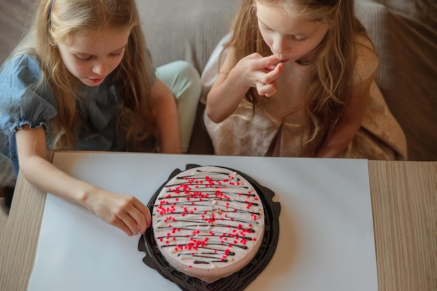 direct children girls caps without hesitation eat birthday beautiful cake with their hands at home