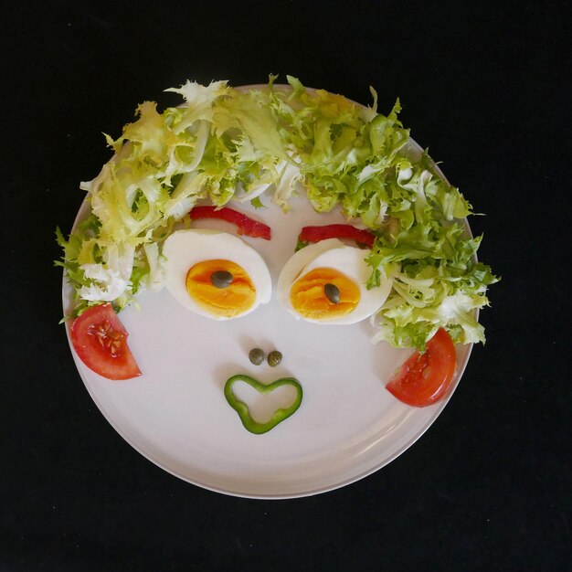 Photo directly above shot of anthropomorphic face made with food