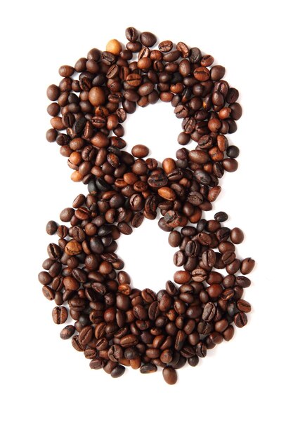 Photo directly above shot of heart shape coffee beans against white background