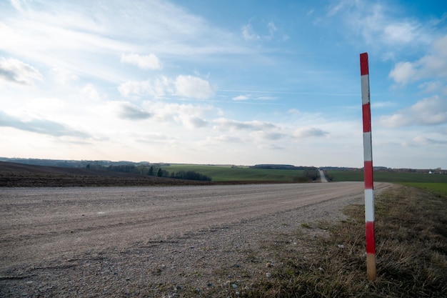 Dirt road in a field outside the city