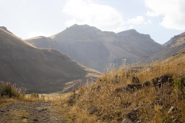 Dirt road goes through the mountains