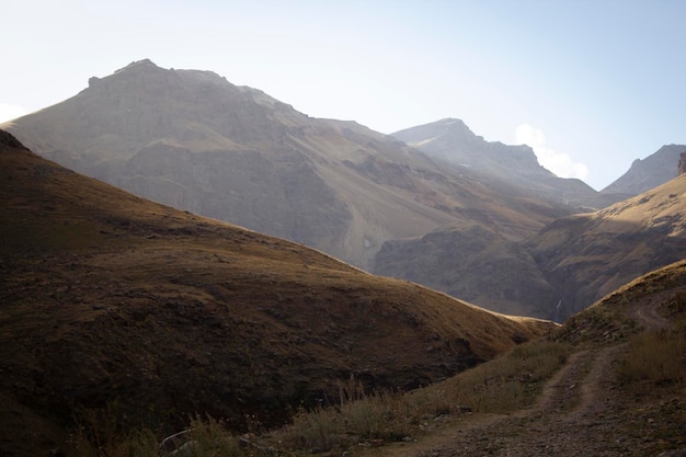 Dirt road goes through the mountains