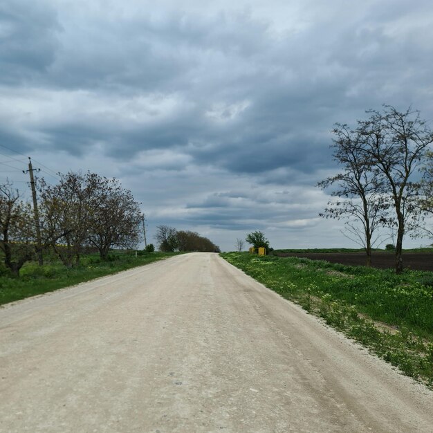 A dirt road is shown with a yellow sign on the right.