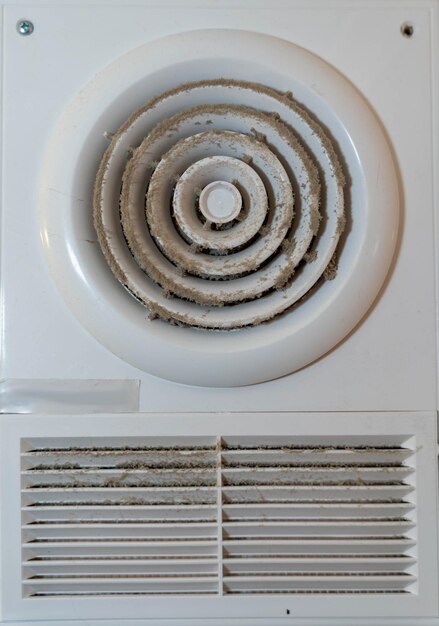 Dirty and Dusty Electric Duct Fan in Bathroom Extractor Hood Needs Cleaning for Proper Ventilation