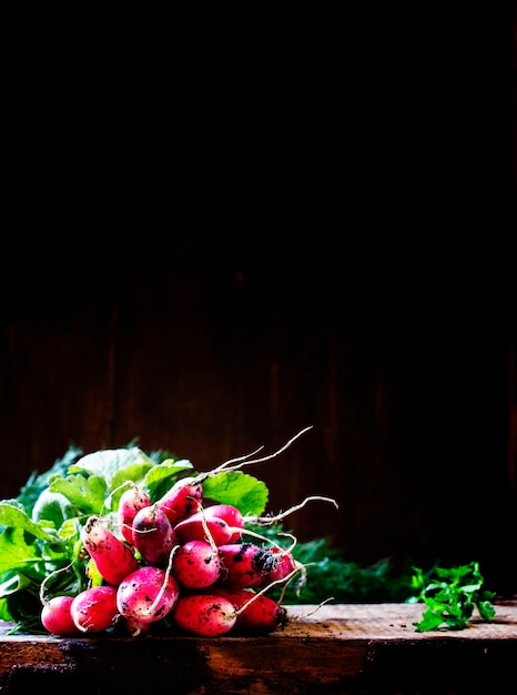 Dirty radish vintage wooden background selective focus