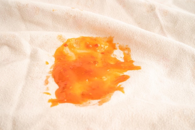 Dirty tomato sauce stain or ketchup on cloth to wash with washing powder cleaning housework concept