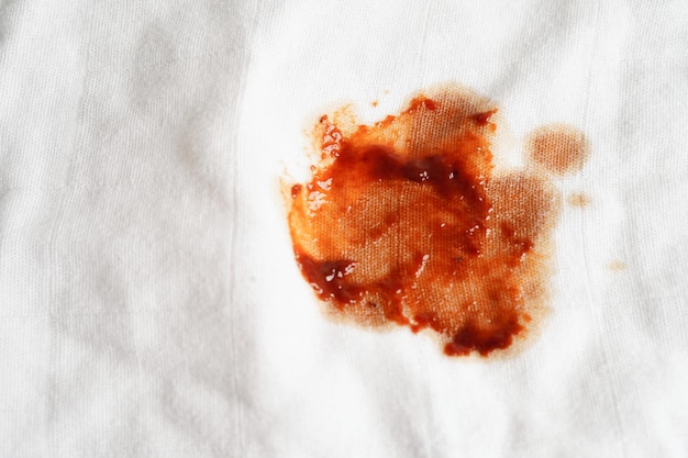 Dirty tomato sauce stain or ketchup on cloth to wash with washing powder cleaning housework concept