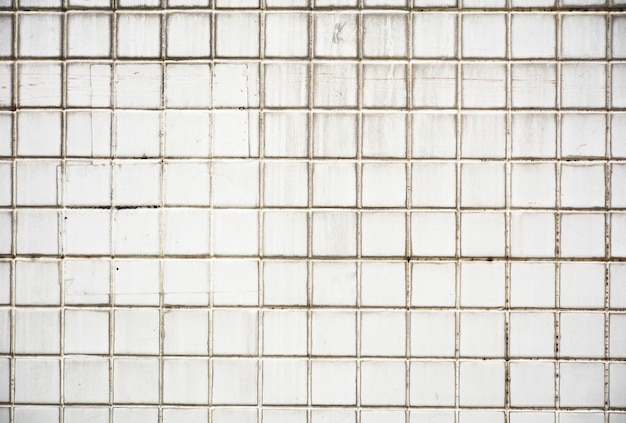 Dirty white ceramic tile at the bathroom