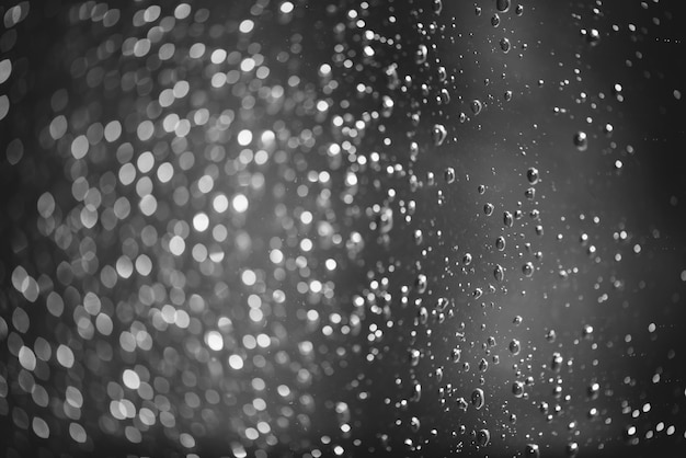 Dirty window glass with drops of rain