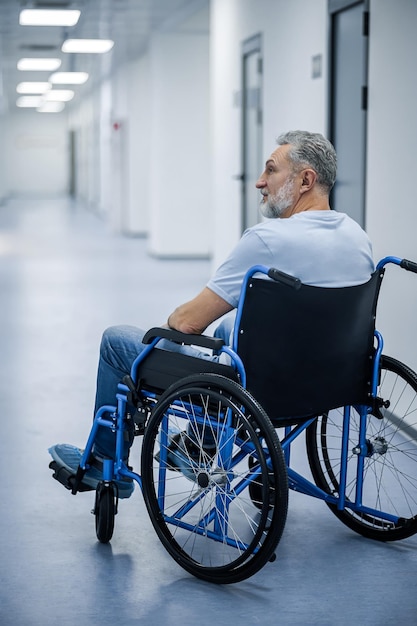 Disabled man in a wheelchair in a rehabilitation center