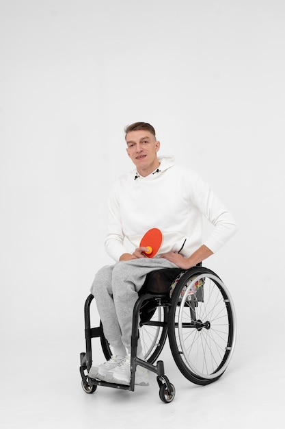 Disabled ping pong player in a wheelchair