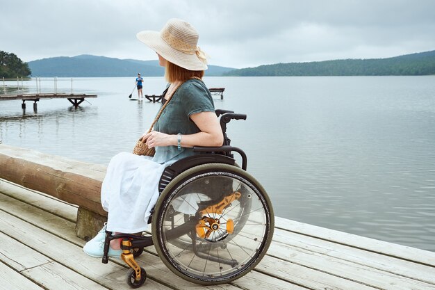 Disabled woman enjoying the beautiful view of the seascape