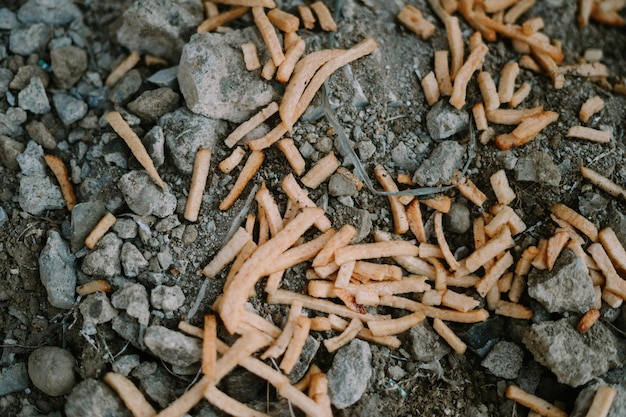 Photo discarded chiki sticks littering the street creating an unsightly and wasteful scene