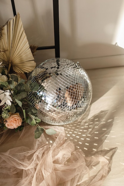 Disco ball in flowers sunlight