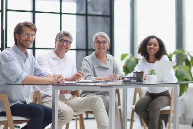 Discussion of business people in the office sitting at the table