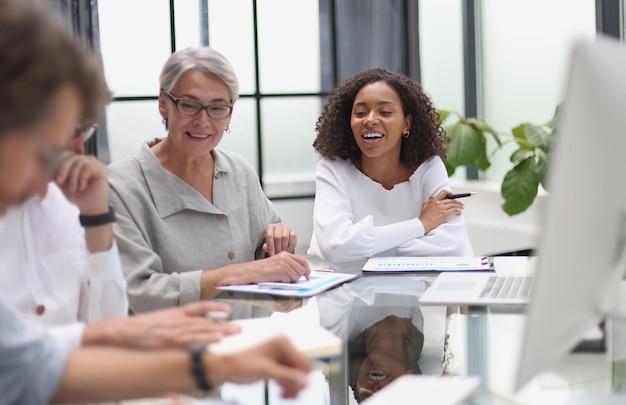 Discussion of business people in the office sitting at the table