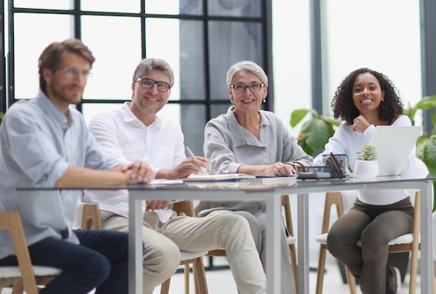 Discussion of business people in the office sitting at the table