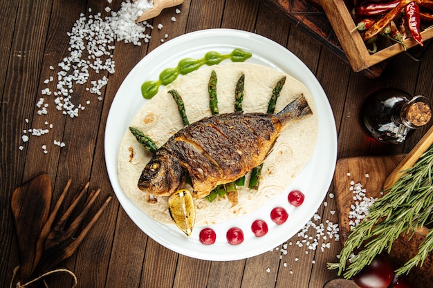 Dish of gourmet grilled dorada fish