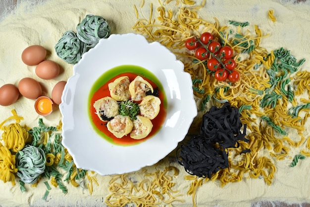 A dish of Italian cuisine conchiglioni with cocktail shrimp in a white plate