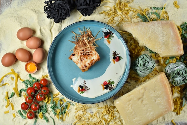 A dish of Italian cuisine Lasagna bolognese in a blue plate