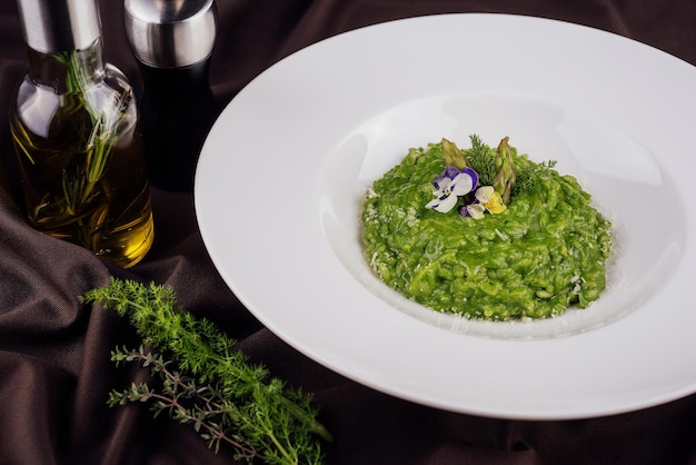 Dish of risotto with asparagus closeup