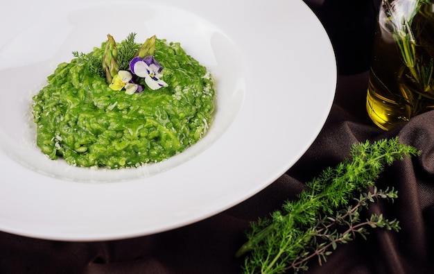 Dish of risotto with asparagus closeup