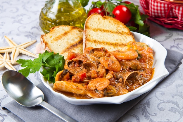 dish with fishsoup and bread