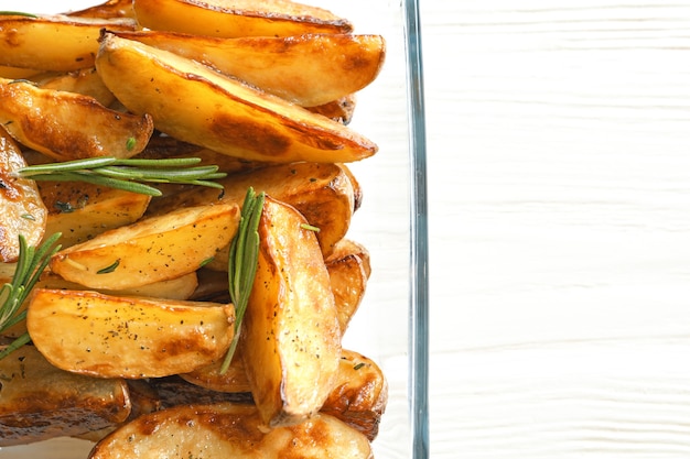 Photo dish with tasty potato wedges, closeup