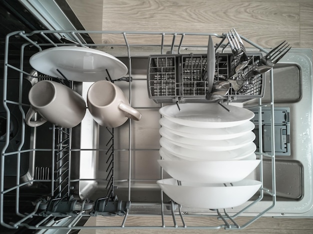 Dishwasher with clean dishes. Cleaning and cleanliness concept.