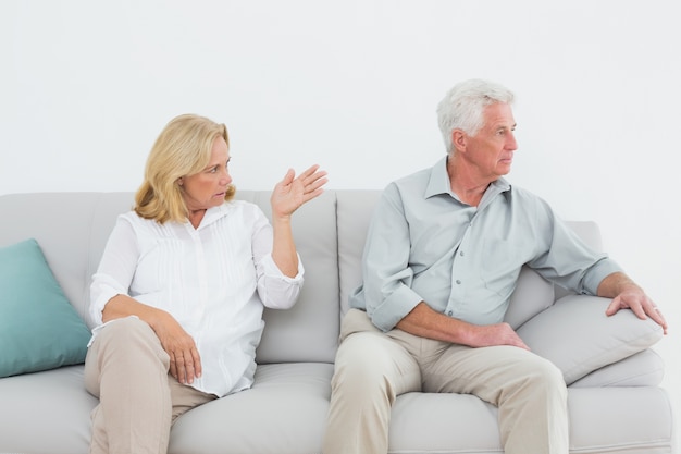 Displeased relaxed senior couple at home