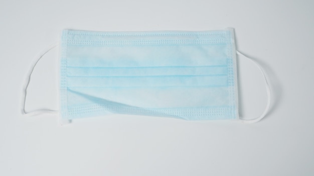 Disposable Ear- loop face mask on white background.