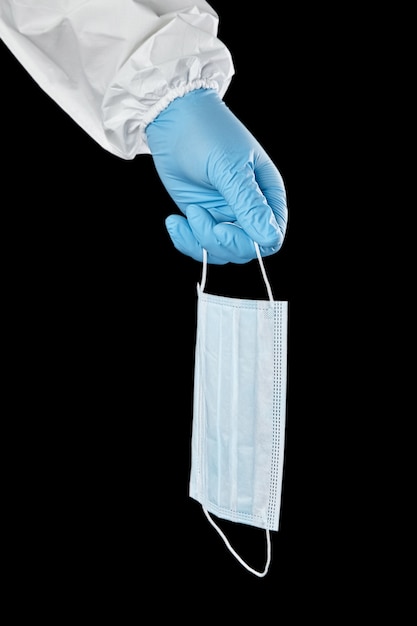 disposable medical sanitary surgical mask in hand