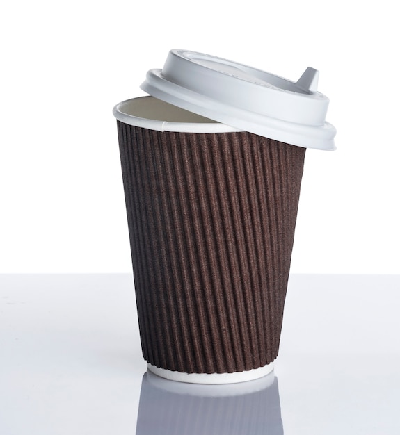 Disposable paper coffee cup on white surface