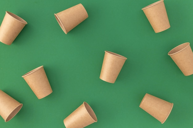 Disposable paper cups on green