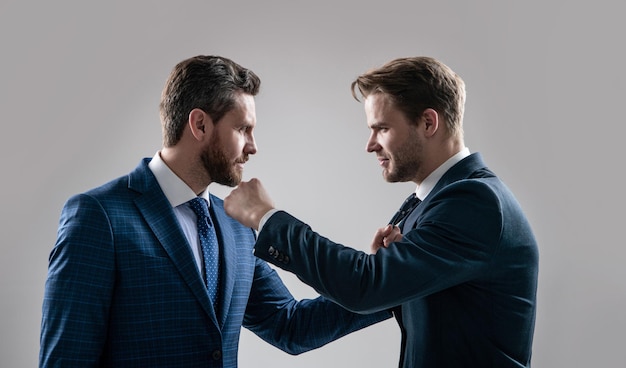 Disrespect and contradiction. business partners blame each other. arguing businesspeople. dissatisfied men discuss failure. two colleagues have disagreement and conflict. businessmen face to face.