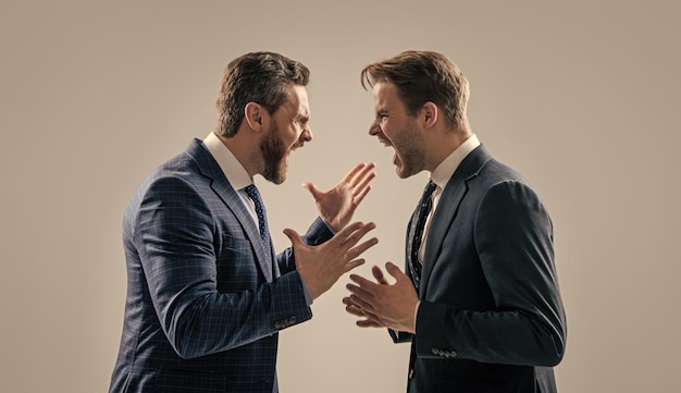 Dissatisfied men discuss failure two colleagues have disagreement and conflict