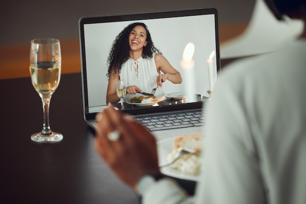 Distance means nothing Shot of two business friends having a virtual dinner date inside