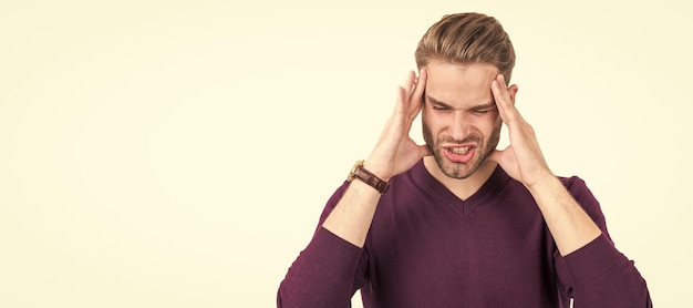 Distressed guy with closed eyes squeeze head with hands suffering from headache migraine Man face