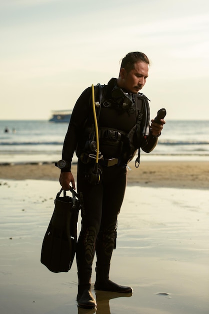 Diver rescue in wetsuit equipment for scuba diving The concept of sports recreation travel