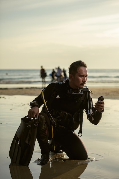 Diver rescue in wetsuit equipment for scuba diving The concept of sports recreation travel